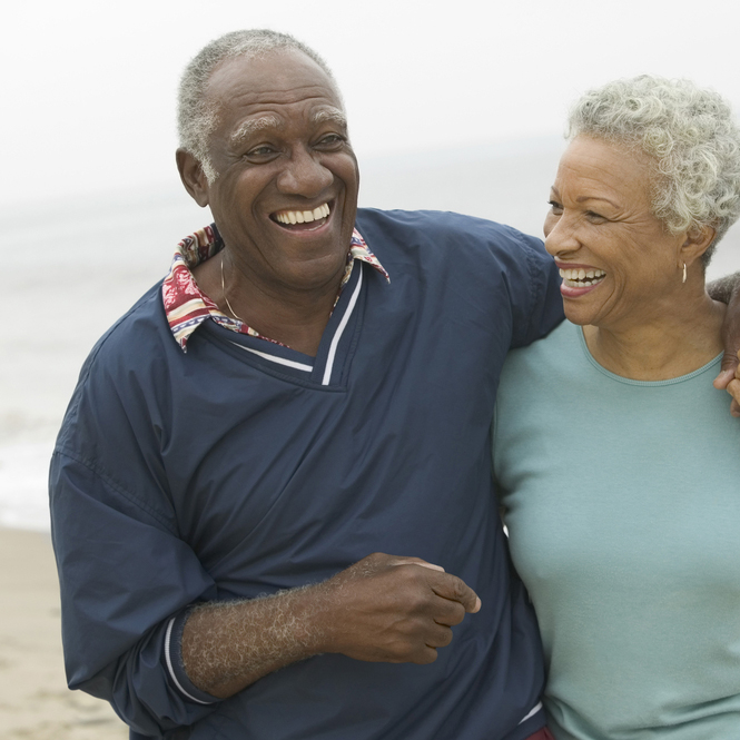 older couple smiling.