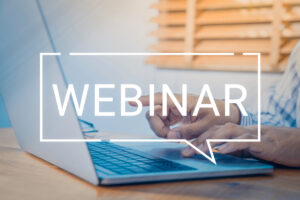 man on laptop interacting with webinar