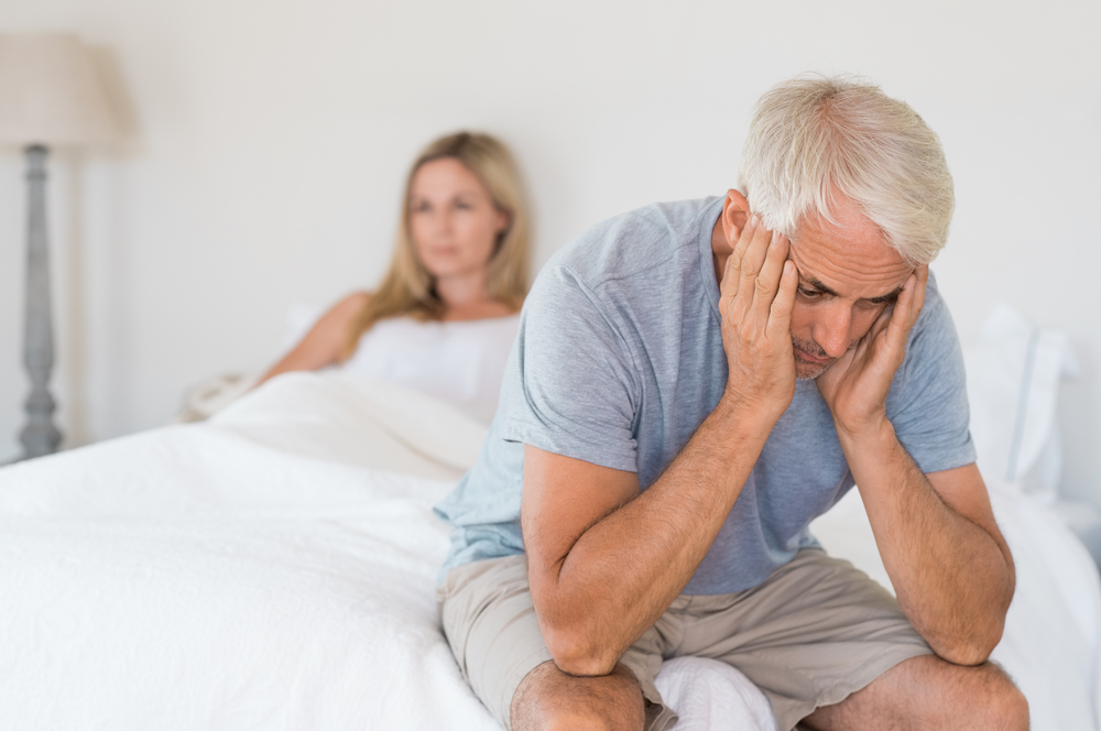 Senior couple angry with each other in bed