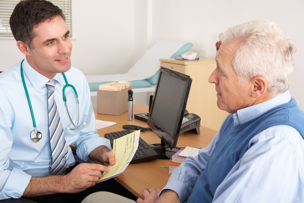 old man talking to his doctor