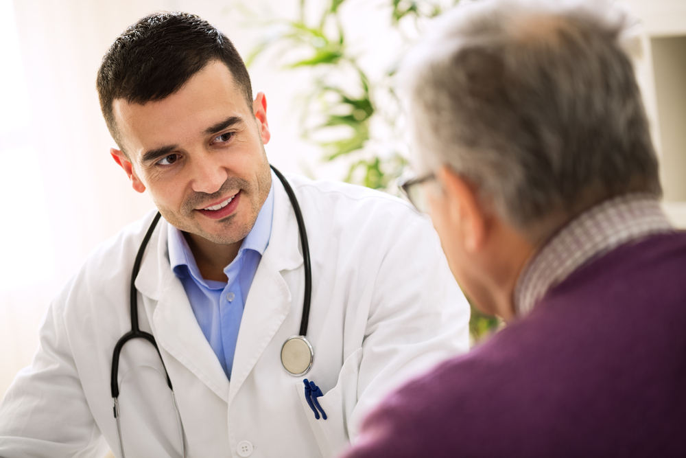 Man discussing erectile dysfunction with a doctor.