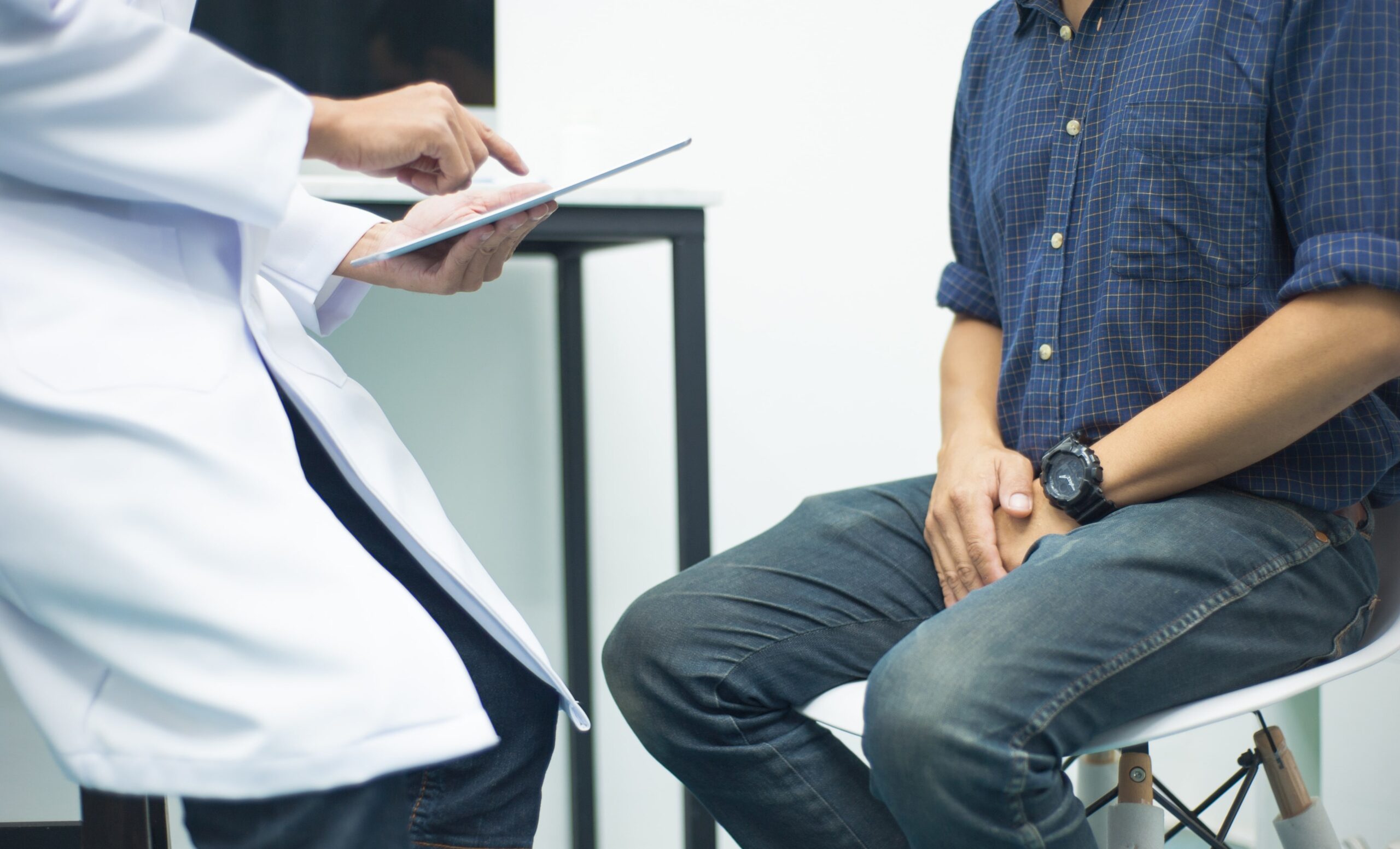 man speaking with a urologist about testicular cancer.